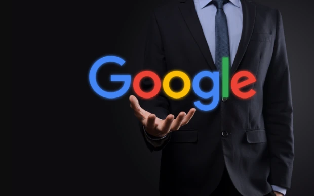 businessman-suit-holds-google-logo businessman-suit-holds-google-logo