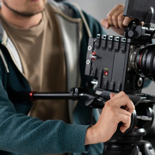 digital-creator-filming-with-professional-camera
